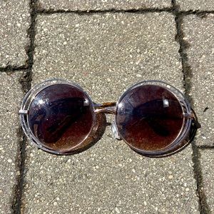 Oversized, circular, gold sunglasses